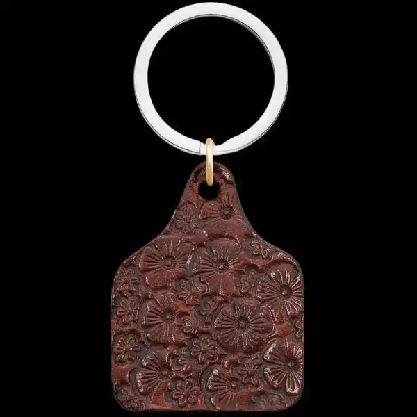 "Our Outsider Custom Keychain is crafted from high-quality leather with our signature leather flower stamp. Order yours today!

Size: 1.875"" by 1.375""


Pair with a Discounted Sterling Silver Chain or a Custom Belt Buckle. 